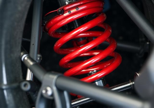 Adjustable performance coilover suspension being installed